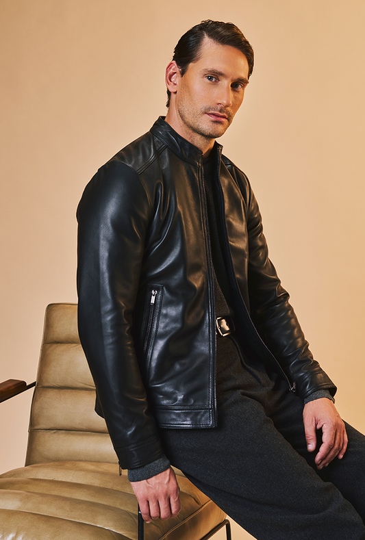 Men’s black genuine lambskin leather biker jacket with a clean, minimalist design, front zip closure, and a slim, lightweight fit.