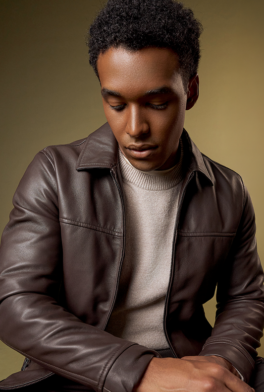 Lightweight brown lambskin leather jacket with a smooth texture, classic shirt collar, and front zipper closure