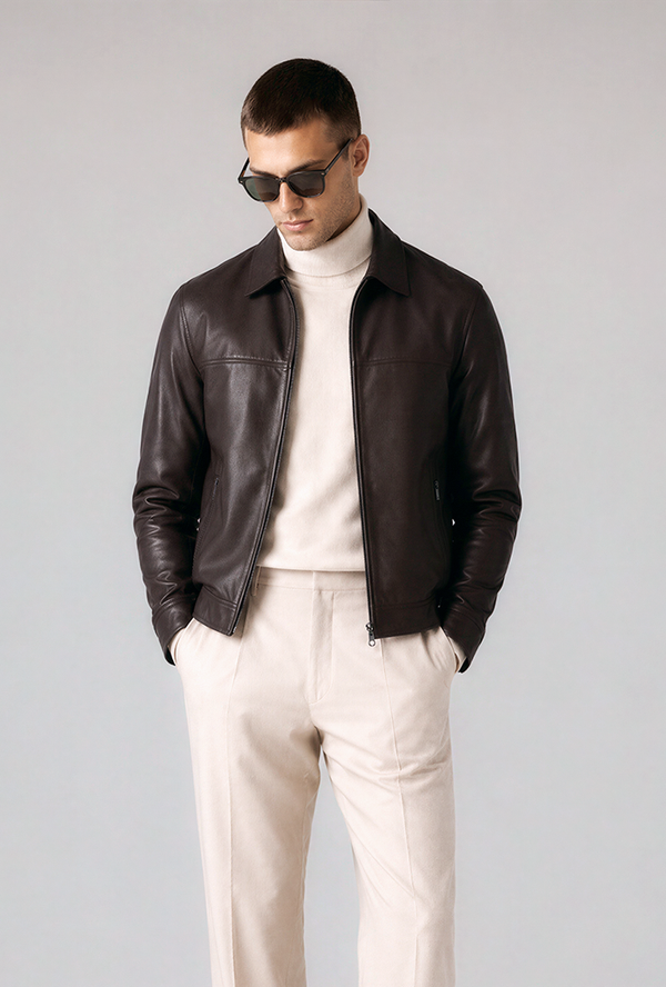 Layer the jacket over a cream turtleneck and cream trousers for a clean, minimal aesthetic. This look balances contrast and texture, making the jacket the statement piece.